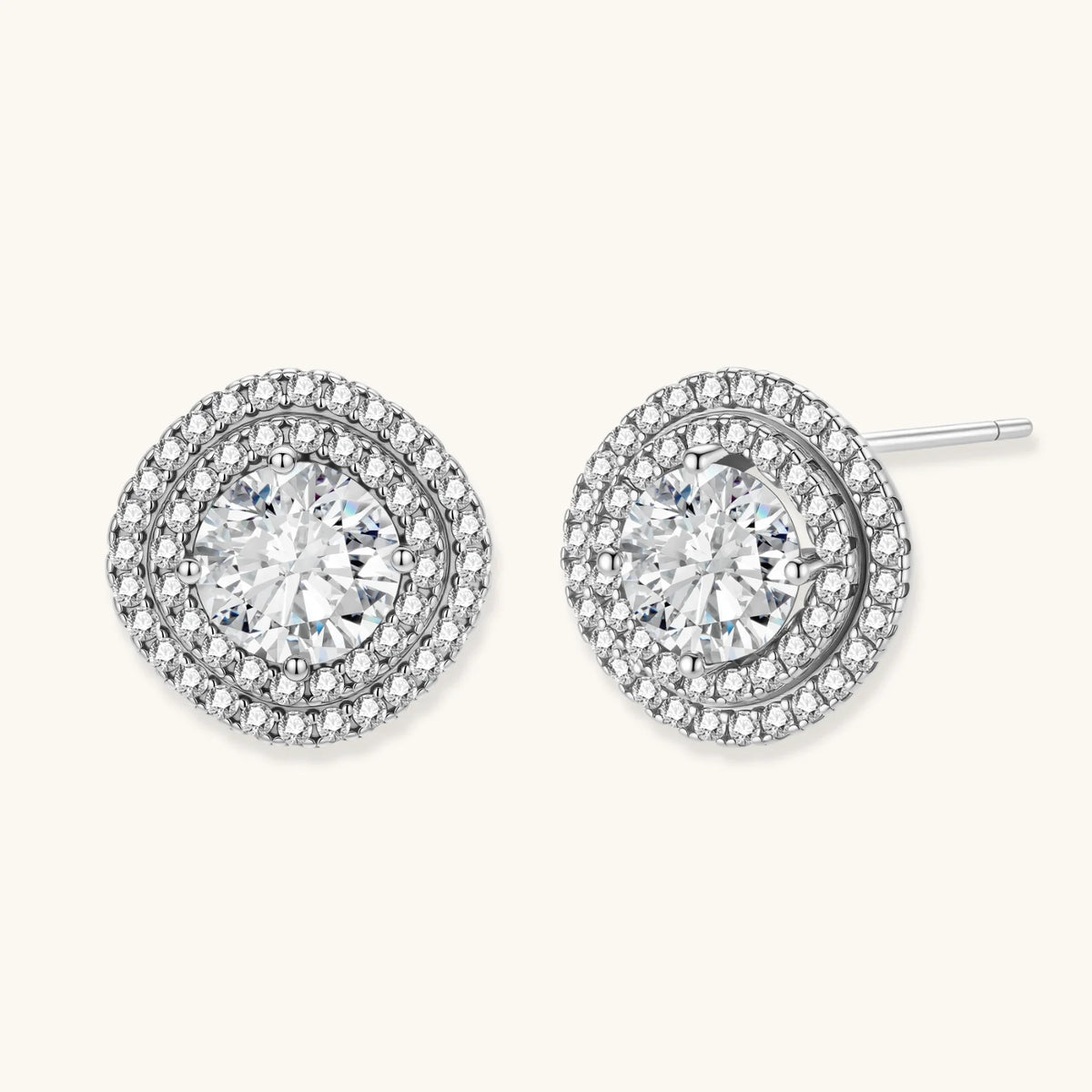 Double halo sterling silver stud earrings with brilliant round moissanite center stones and pavé crystal accents