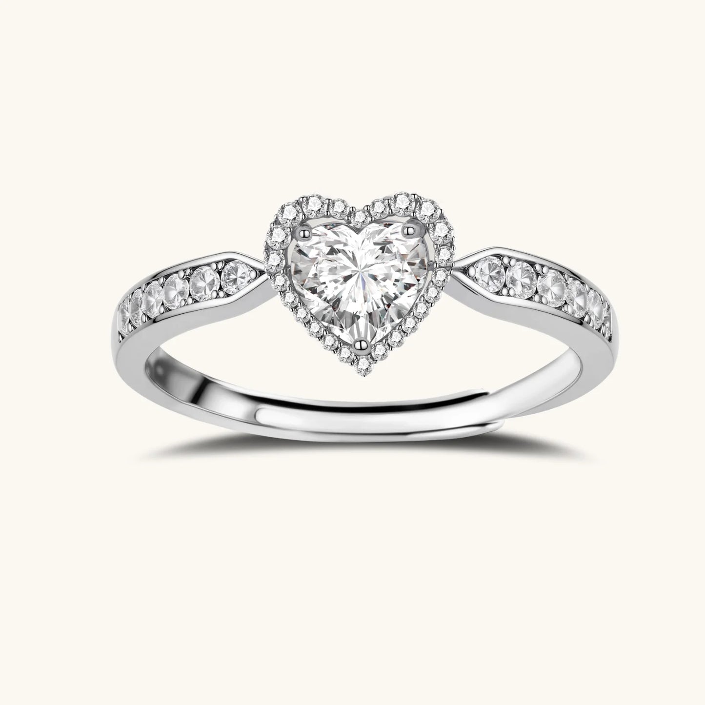 Complete jewelry set with heart-shaped sterling silver pieces featuring brilliant moissanite stones on white background.