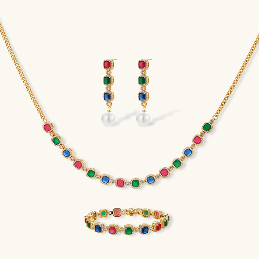 Gold-plated jewelry set with red, green, and blue cubic zirconia stones including necklace, bracelet, and drop earrings.