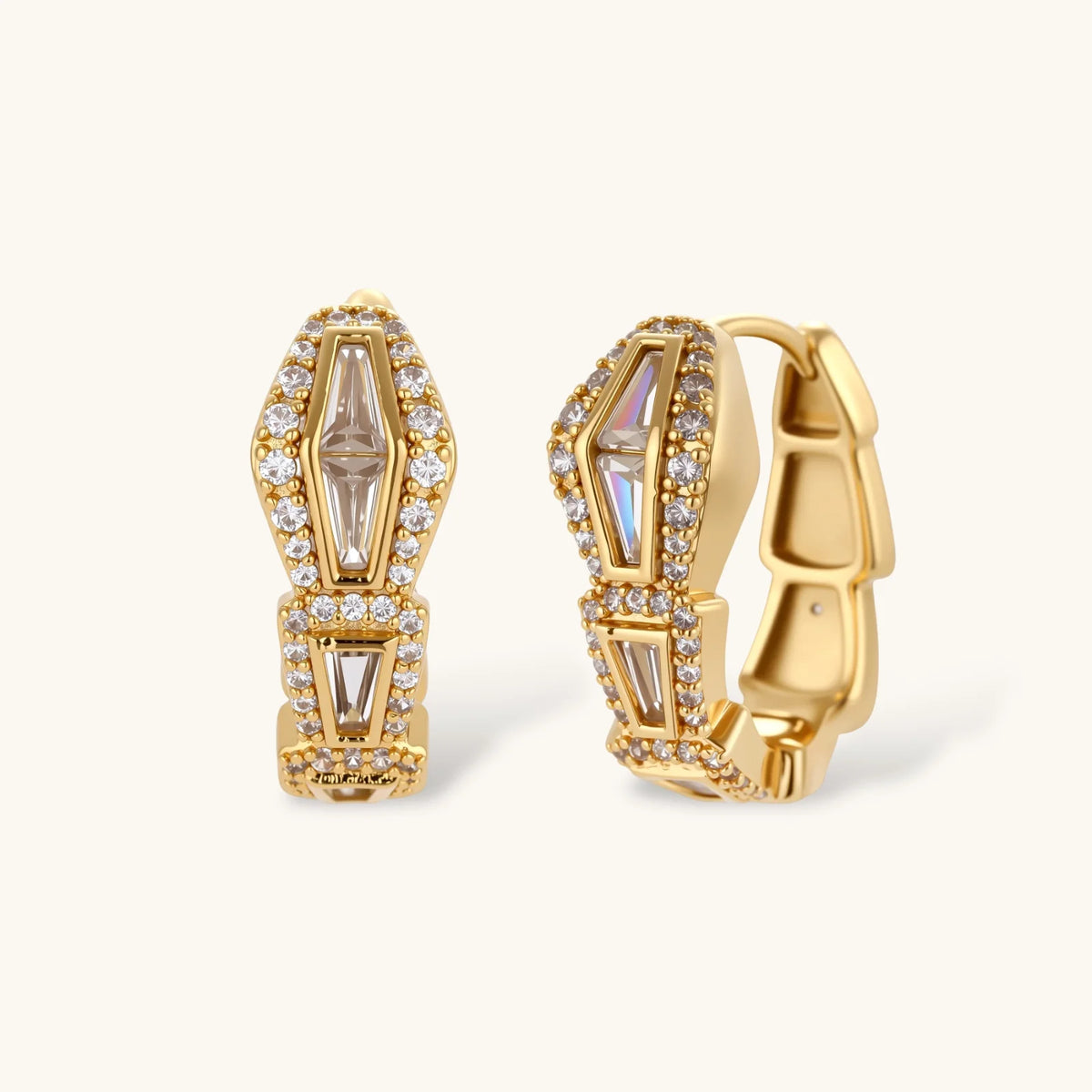 Gold-plated necklace with geometric diamond segments and matching huggie earrings featuring cubic zirconia details