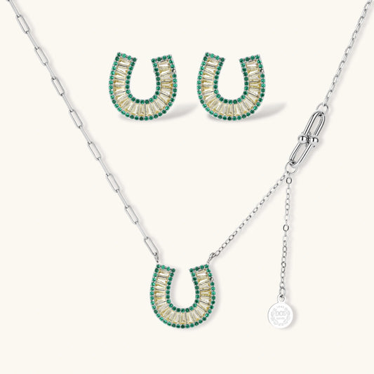 Geometric horseshoe-shaped jewelry set with radiating white zirconia center and jade-green border stones on white background.