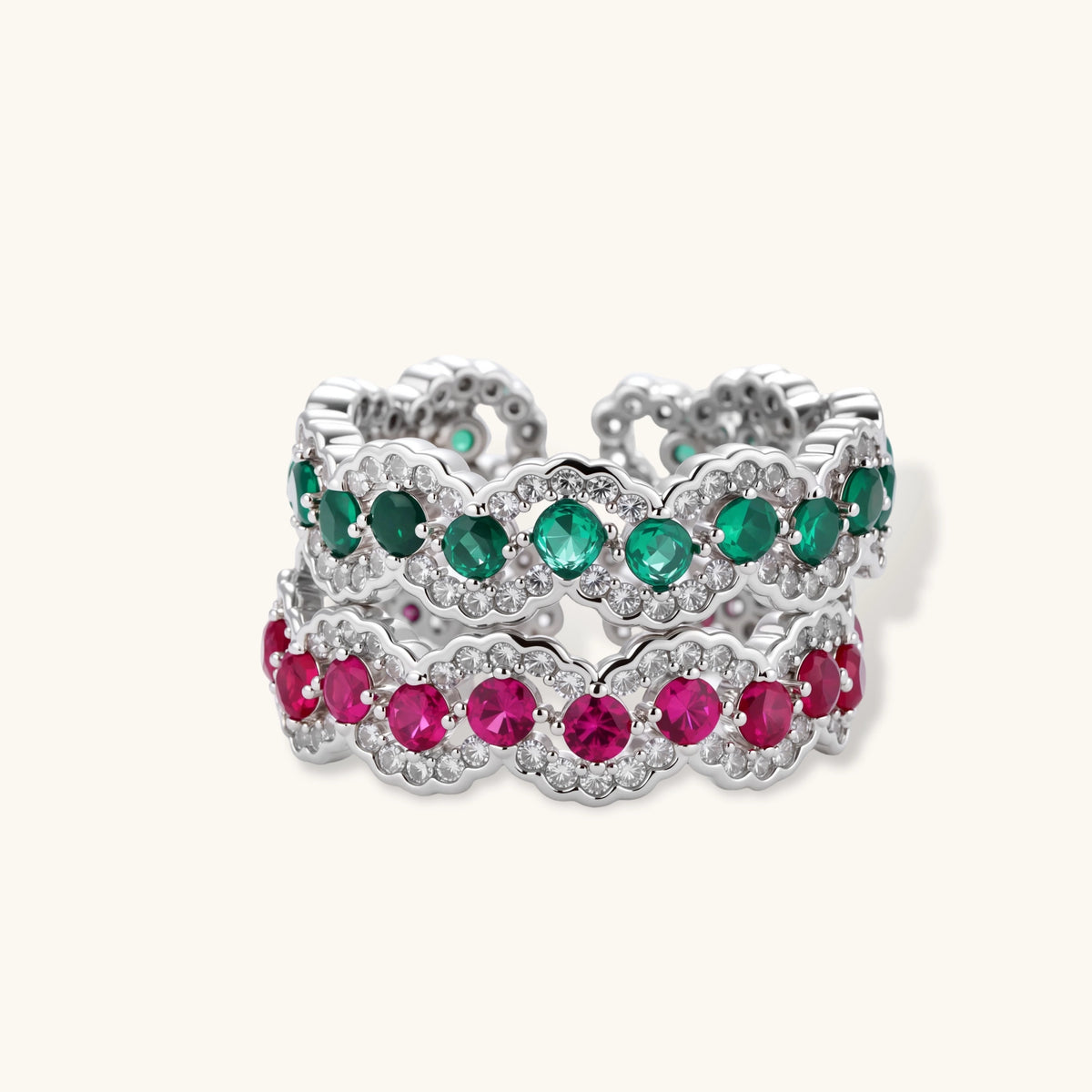 Open-back adjustable ring with round green zirconia stones and white zirconia scalloped edges in white gold plated eco-brass.